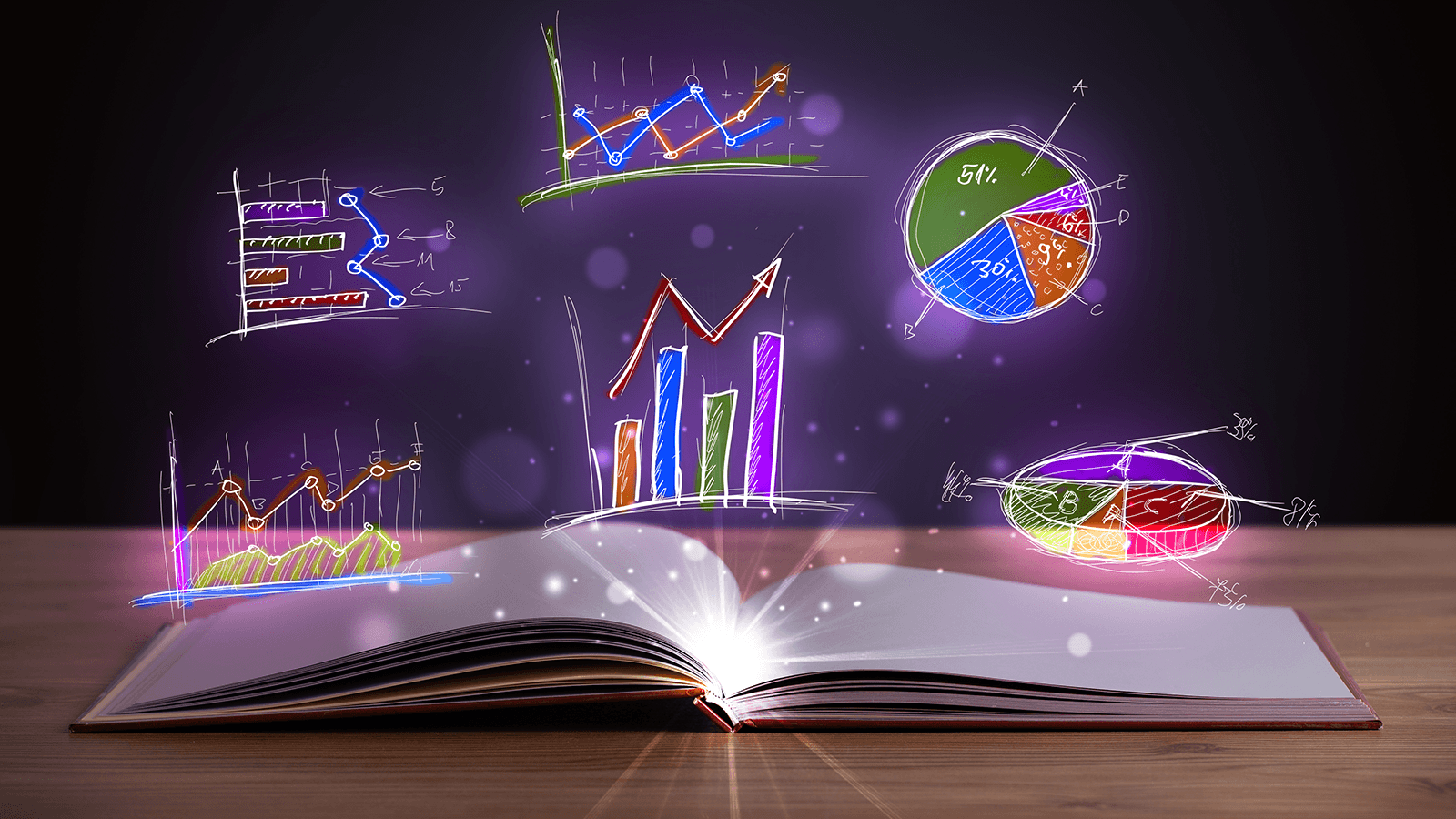 Glowing graphs floating over a book