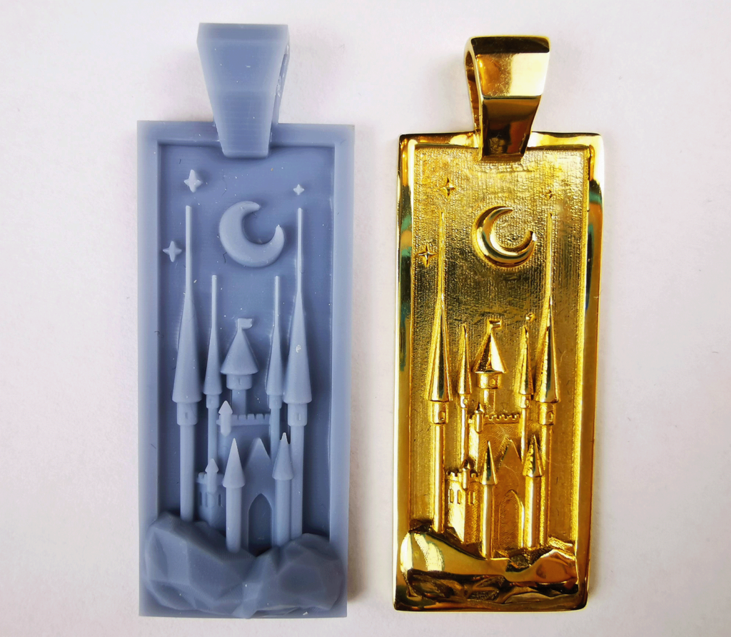 Comparison of finished brass jewelry piece and resin test print.